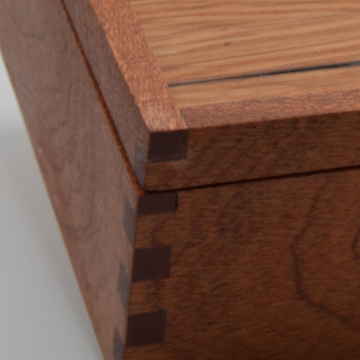 Close-up of a box edge and lid seam showing fit and surface.