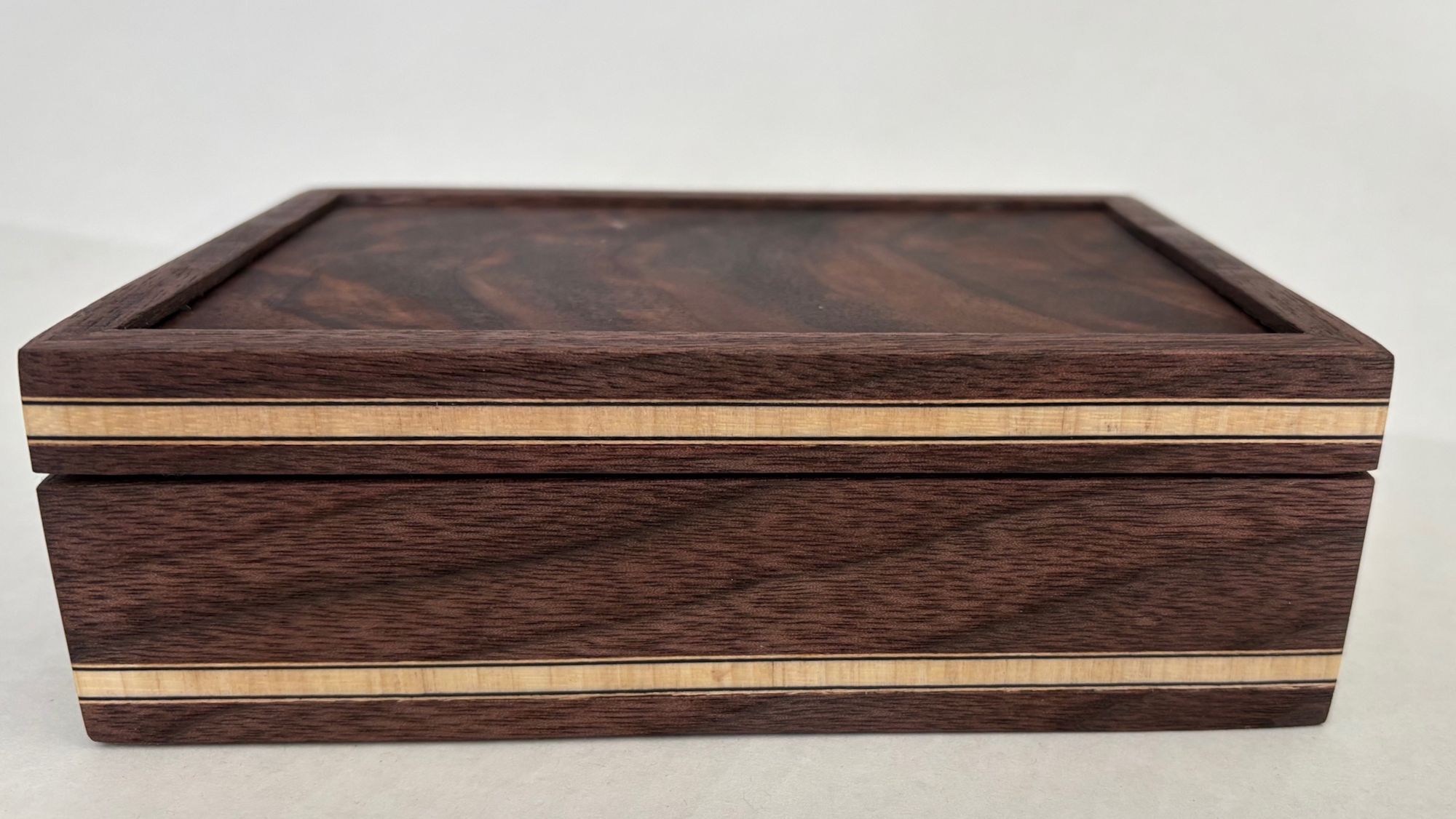 Two wooden boxes with light banding
